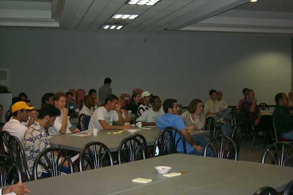 photo: people sitting around tables discussing transportation planning