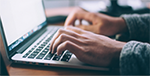 image of person typing on keyboard